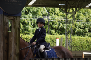 Martina Torres, a third grade student of The Columbus School, and a rider at Club Campestre Llanogrande, attended the competition held there on October 5th. She has been riding for around two years in the Academy at Club Campestre Llanogrande with the teacher Paola Gutierrez. 
“I feel very happy and excited because I love horses and I love the adrenaline from jumping. I also feel nervous,” Torres said.

